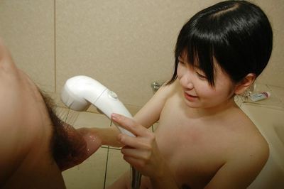 Lusty Japanese young gives a carnal oral sex on a swollen weenie in the washroom